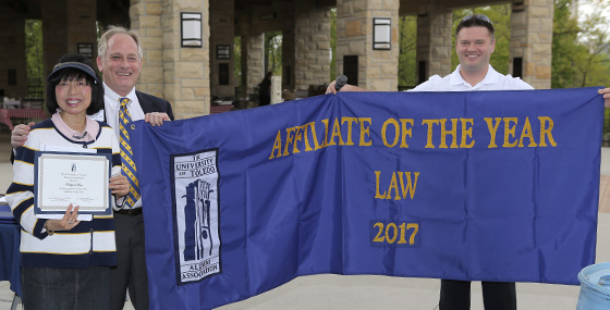 Law Alumni Affiliate representatives holding the Affiliate of the Year banner