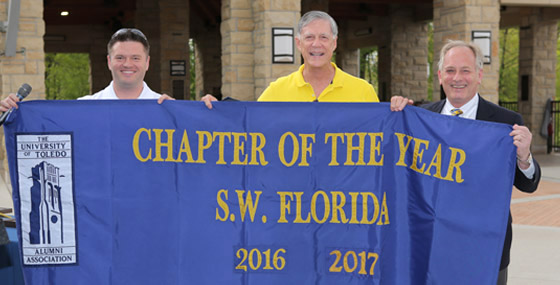 The Fort Myers Alumni Chapter accepts the award for Chapter of the year in 2017
