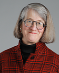 Headshot photo of Barbara Floyd smiling at camera