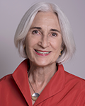 Headshot photo of Patricia Levey smiling at camera