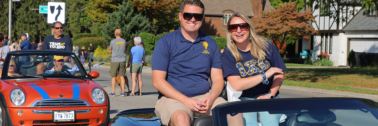 Two alumni in the homecoming parade